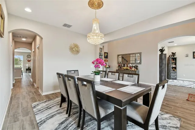 a kitchen with stainless steel appliances kitchen island granite countertop a stove and a sink