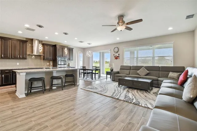 a kitchen with counter top space a sink and appliances