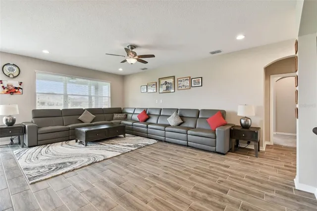 a view of a hallway view with wooden floor and staircase
