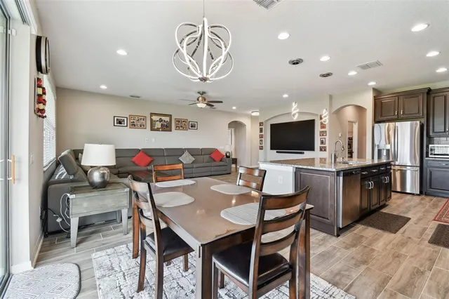 a bathroom with a shower sink and mirror