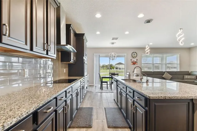 a bed room with a bed and a chair