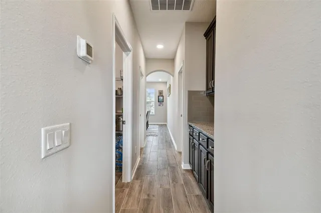 a spacious bedroom with a bed and a window