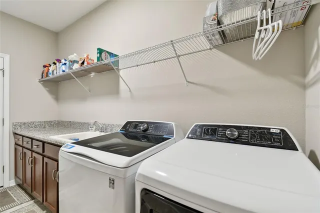 a bathroom with a sink toilet and a mirror