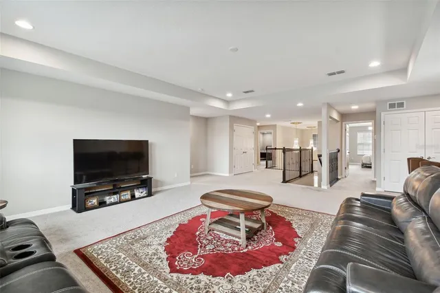 a view of a swimming pool with an outdoor seating and kitchen
