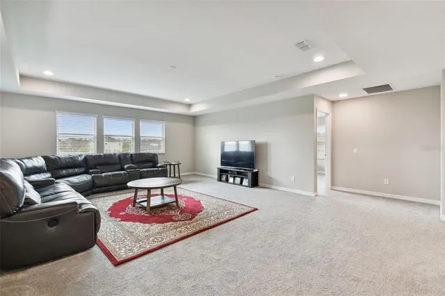 a view of a lake with houses in the background