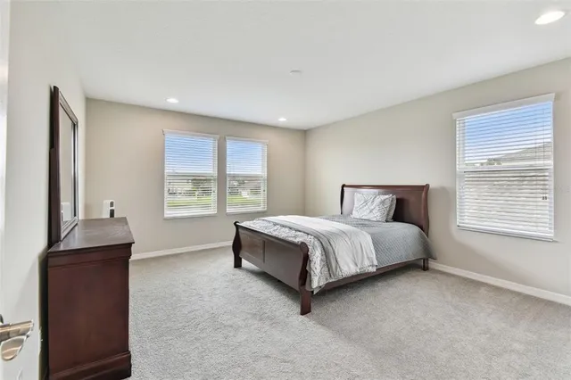 an aerial view of a house with a lake view