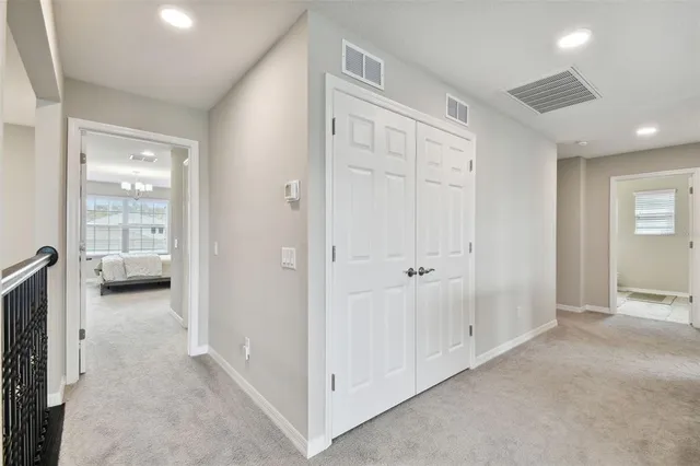 an aerial view of a house with a yard and lake view