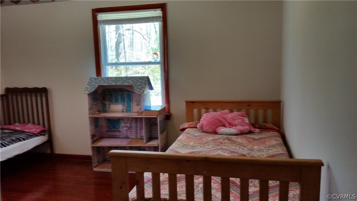 9420 Cosby Mill Road Quinton, VA 23141 - Photo 16 of 19 a bedroom with a bed and a window