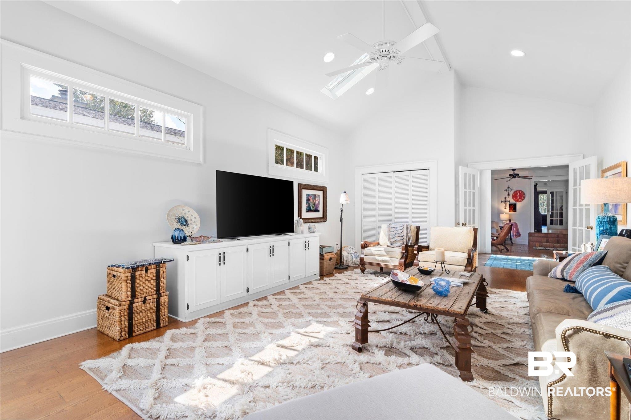 202 Woodlands Avenue Mobile, AL 36607 - Photo 23 of 53 Living room with high vaulted ceiling, light wood-type flooring, and ceiling fan