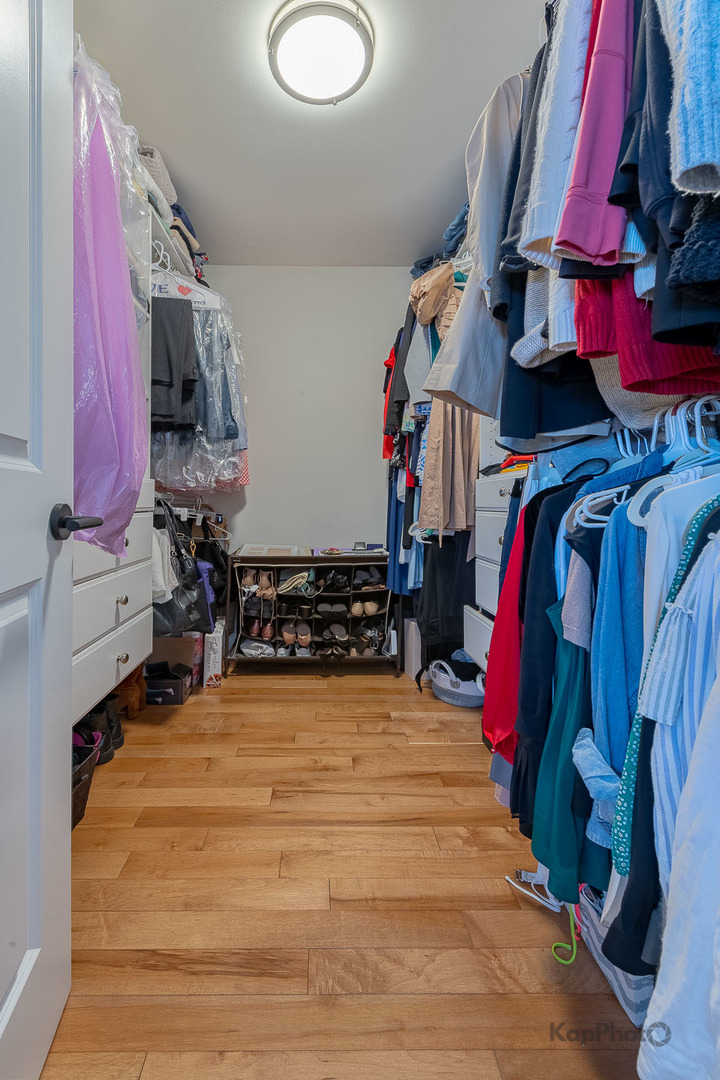 333 Bramble Lane Schaumburg, IL 60193 - Photo 24 of 33 a view of walk in closet with clothes and shoes