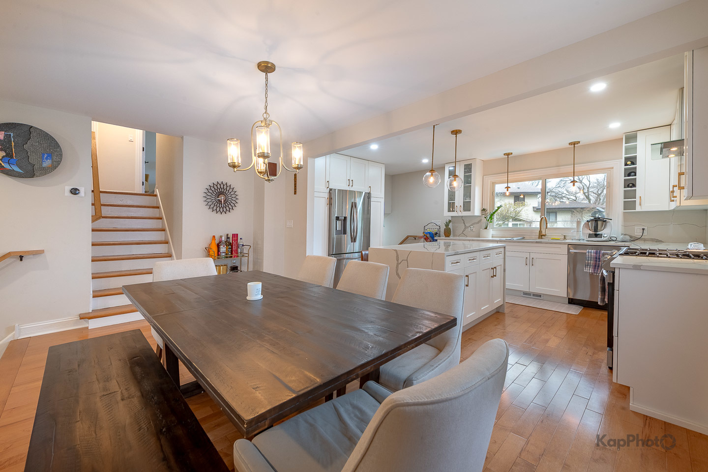 333 Bramble Lane Schaumburg, IL 60193 - Photo 10 of 33 a dining room with kitchen island stainless steel appliances furniture a large window with wooden floor