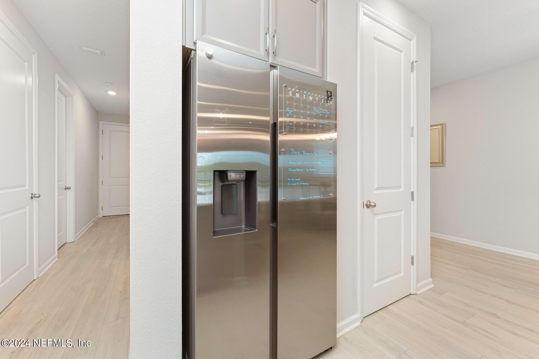 10279 Innovation Way Jacksonville, FL 32256 - Photo 13 of 42 a metallic refrigerator freezer and a glass door