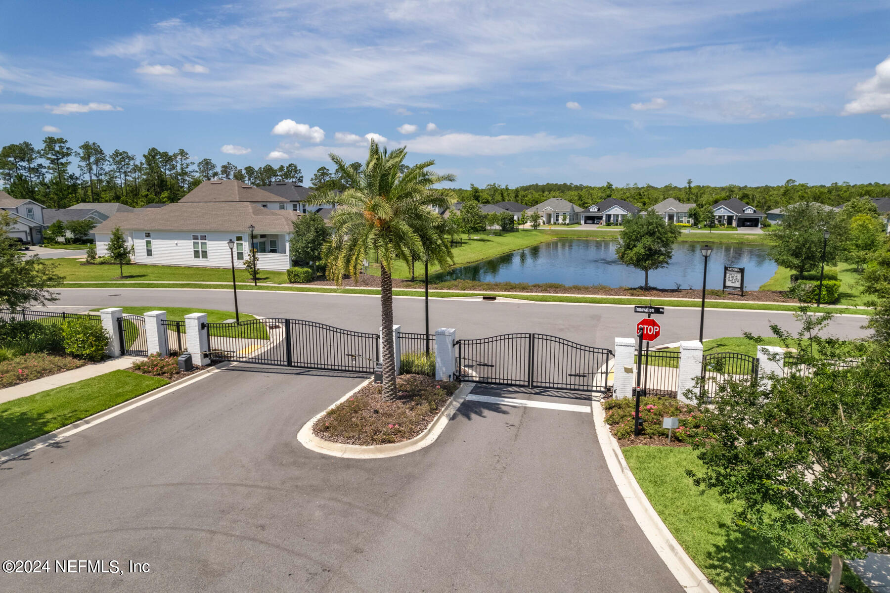 10279 Innovation Way Jacksonville, FL 32256 - Photo 3 of 42 a view of swimming pool with seating area and green space