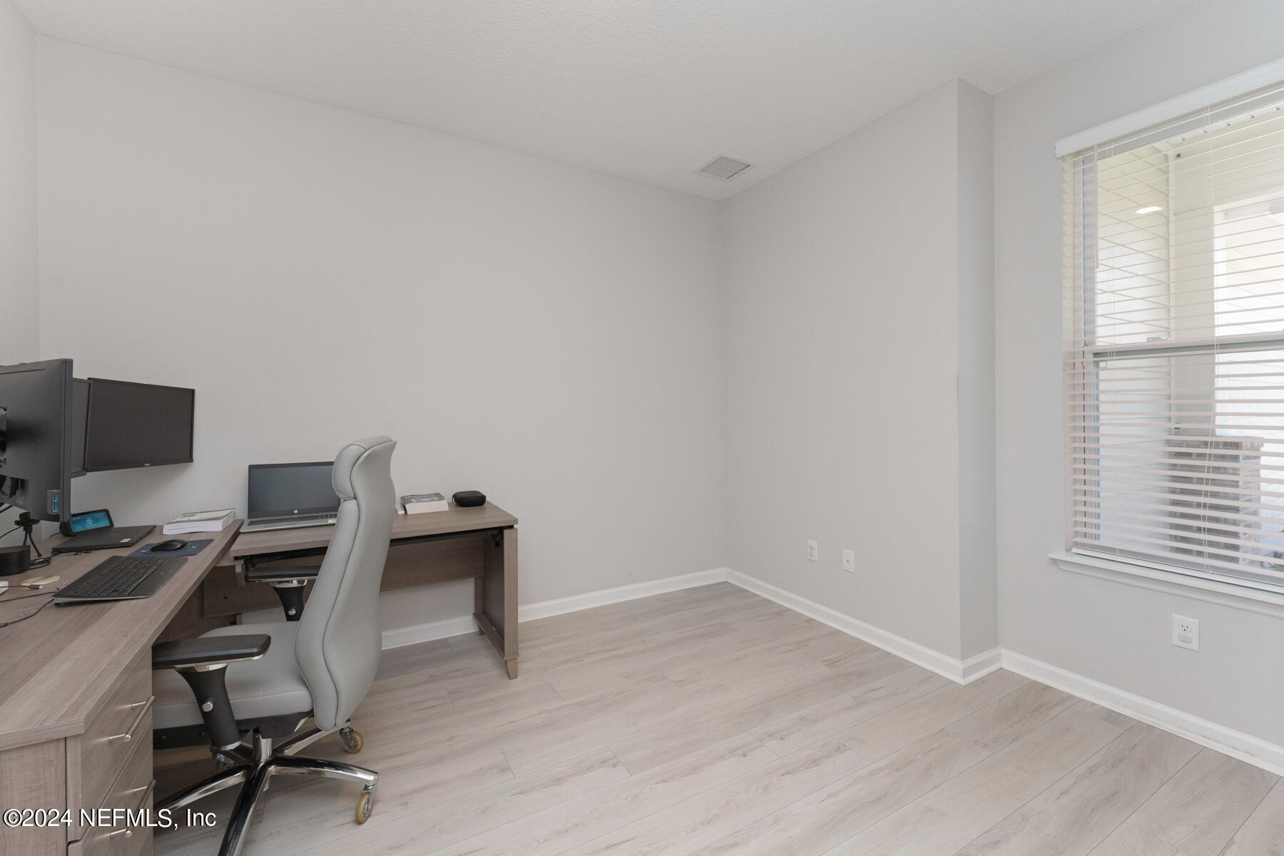 10279 Innovation Way Jacksonville, FL 32256 - Photo 7 of 42 a view of a workspace with furniture and a window