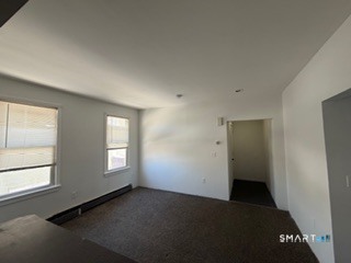 13 Jefferson Avenue, Unit 2 New London, CT 06320 - Photo 4 of 5 an empty room with windows