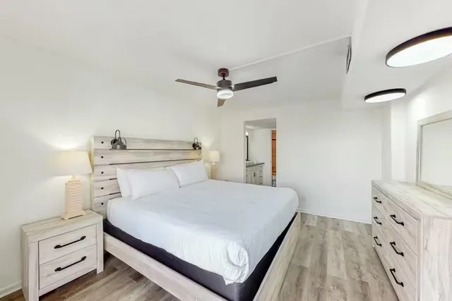 a bedroom with a bed and a dresser