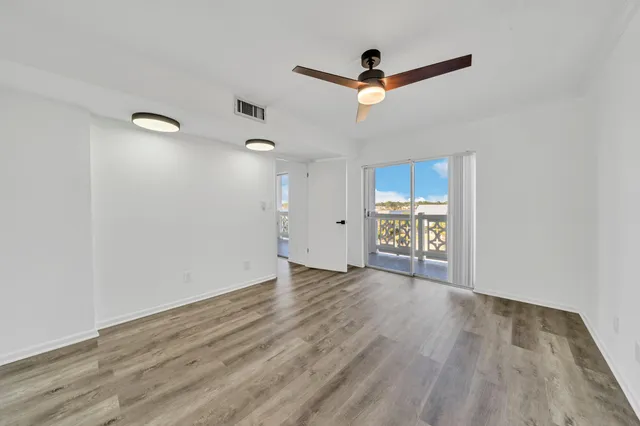 a bathroom with a granite countertop double vanity sink and mirror
