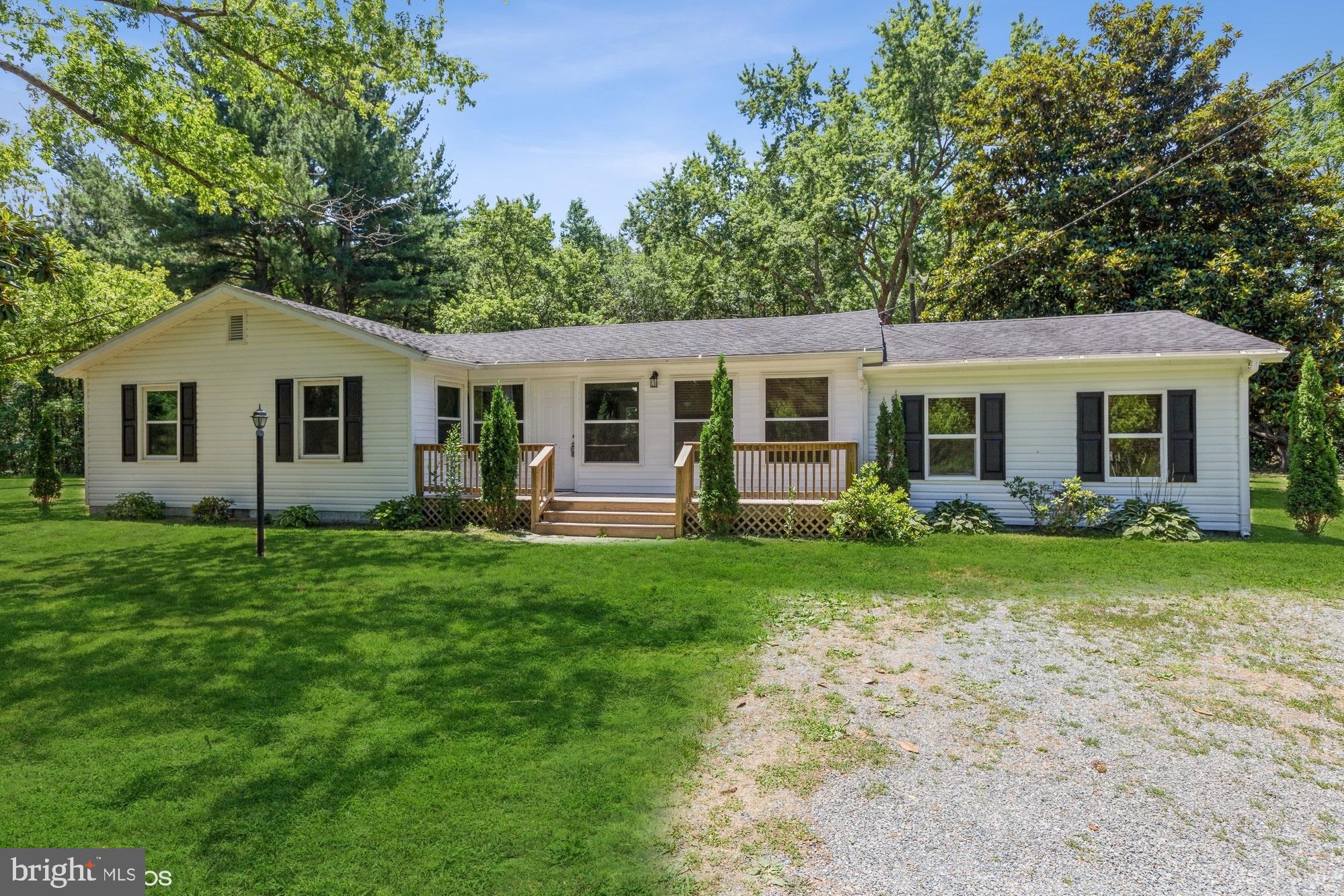 32593 Perryhawkin Road Princess Anne, MD 21853 - Photo 1 of 31 a view of a house with backyard and garden