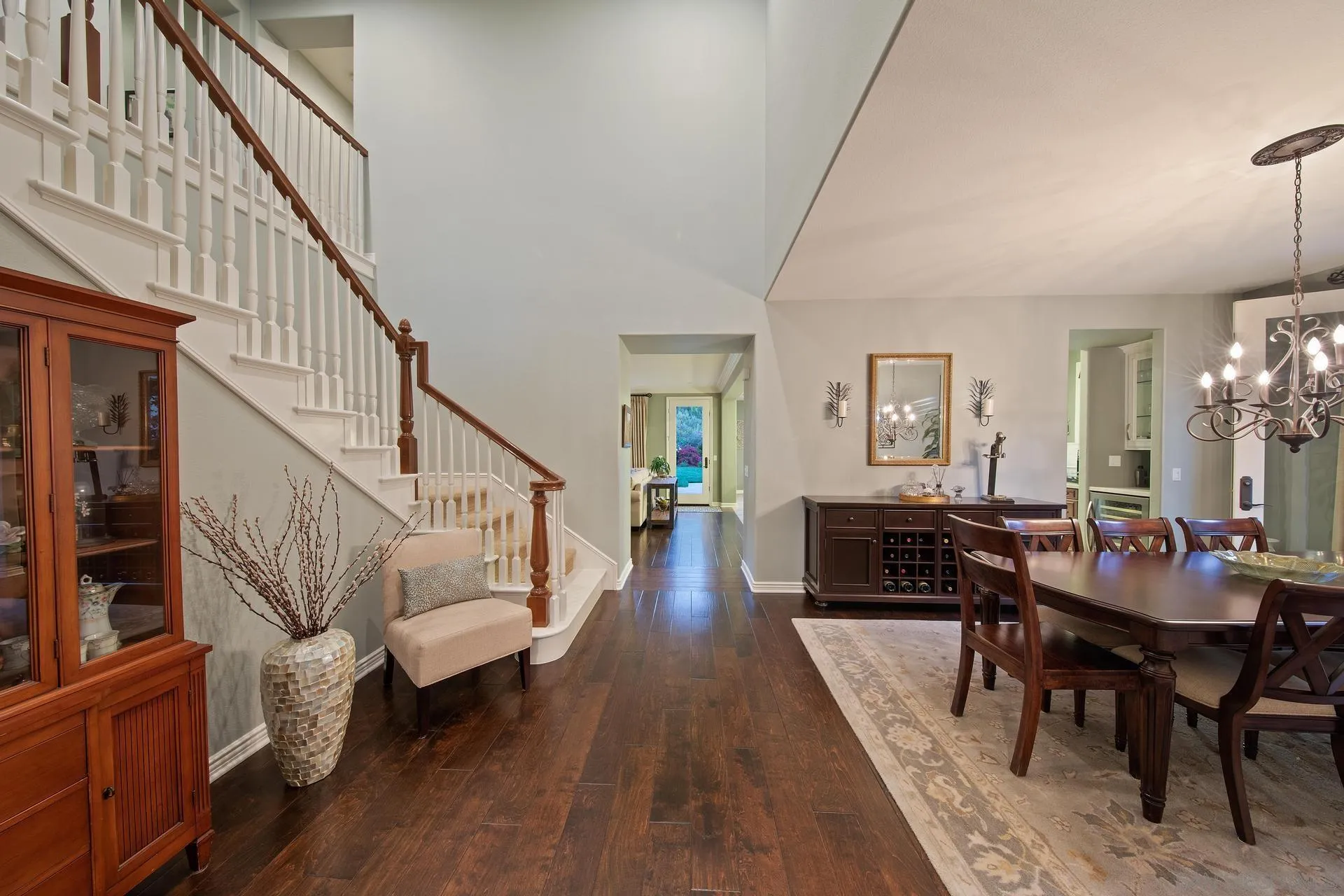 14619 Whispering Ridge Road San Diego, CA 92131 - Photo 18 of 50 a living room with wooden floor and a dining table
