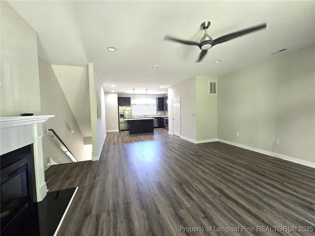 a view of livingroom with hardwood floor and a ceiling fan