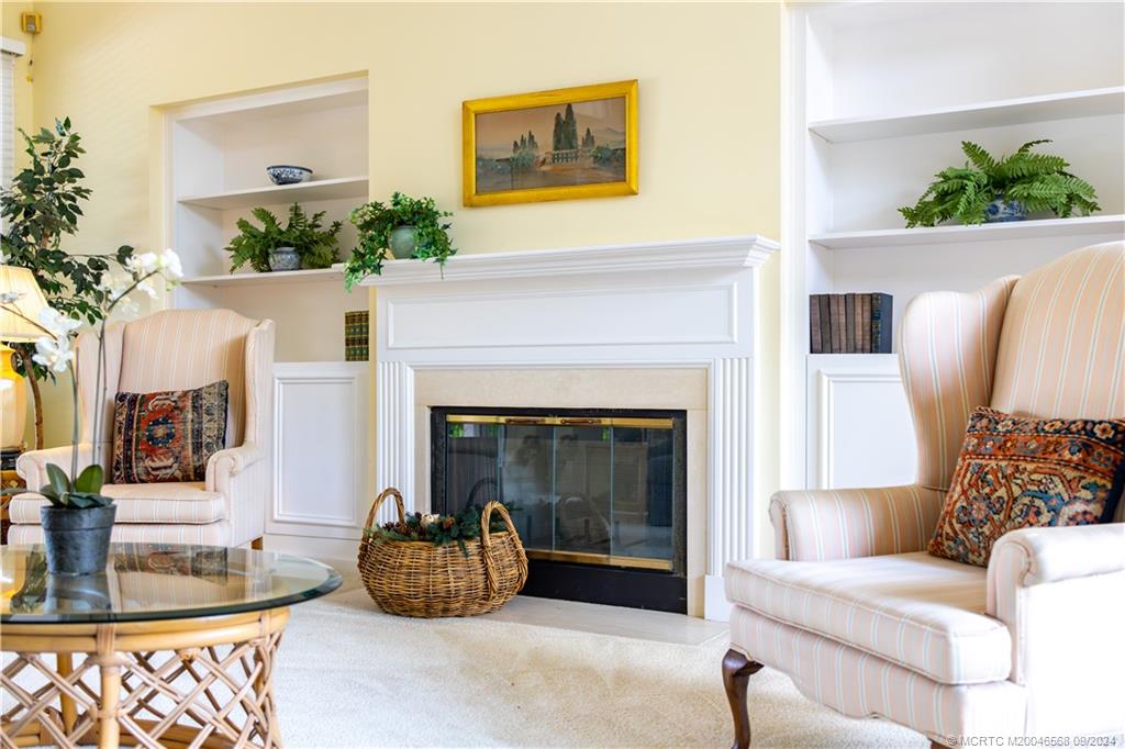 Undisclosed Address Stuart, FL 34997 - Photo 27 of 52 a living room with furniture and a fireplace