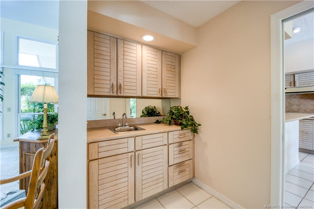 Undisclosed Address Stuart, FL 34997 - Photo 34 of 52 a bathroom with a sink a vanity and a mirror