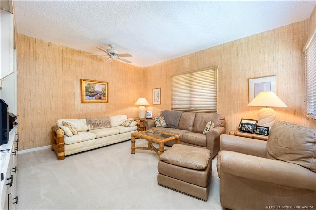 Undisclosed Address Stuart, FL 34997 - Photo 39 of 52 a living room with furniture and a large window