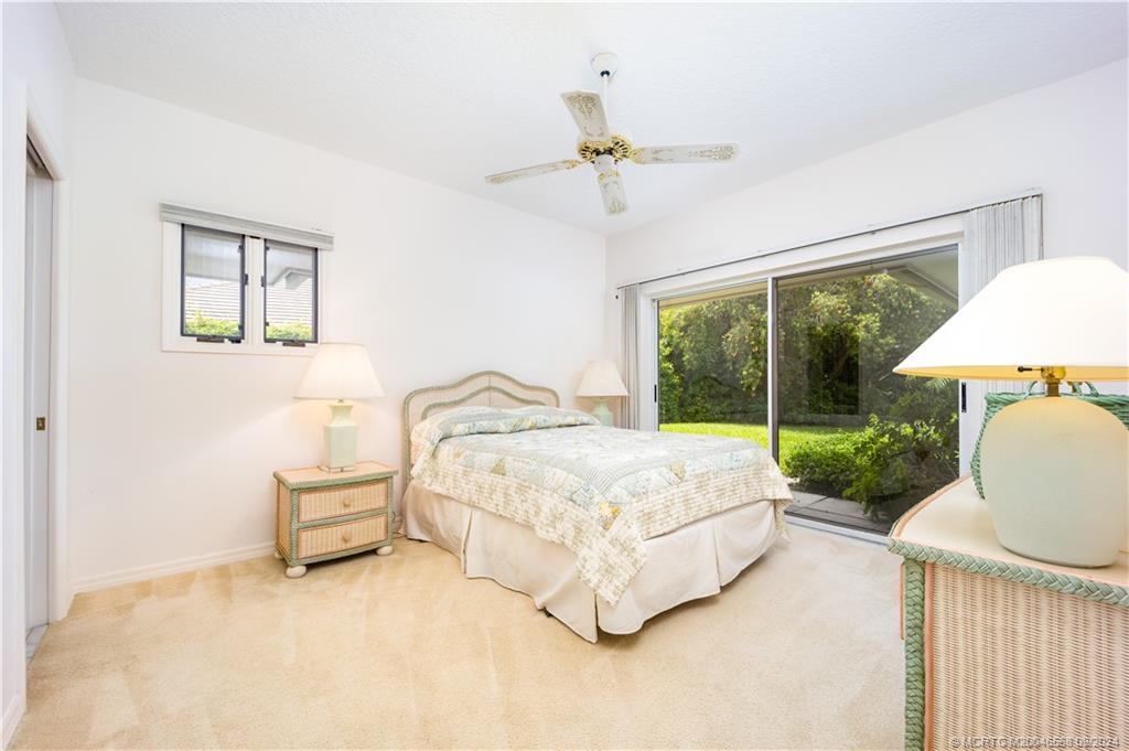 Undisclosed Address Stuart, FL 34997 - Photo 43 of 52 a bed sitting in a bedroom next to a window