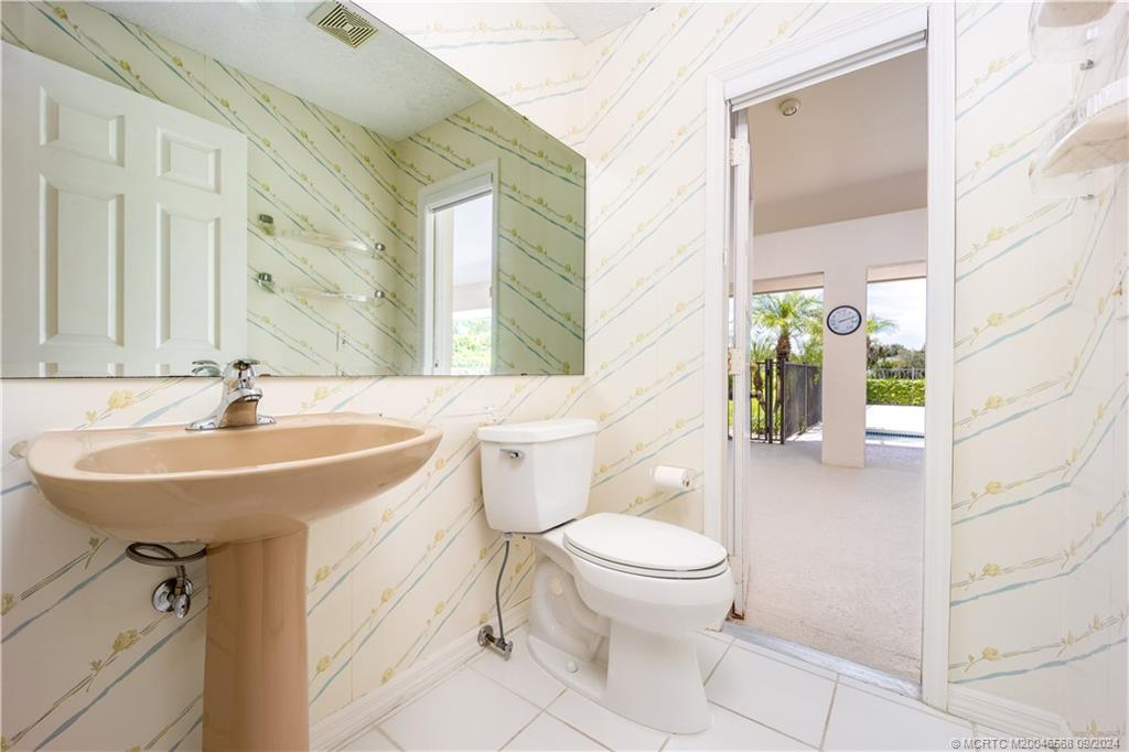 Undisclosed Address Stuart, FL 34997 - Photo 44 of 52 a bathroom with a sink toilet and shower