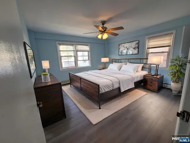 a bed room with a bed and a chandelier