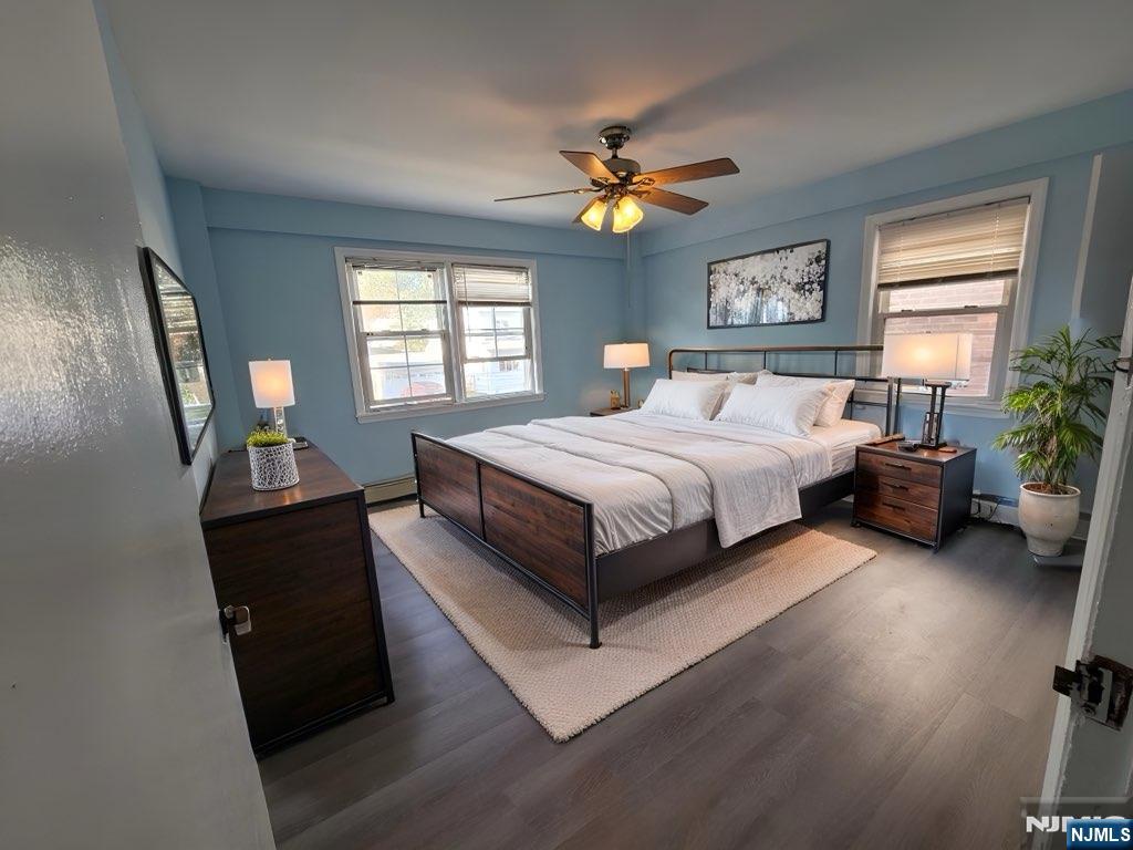 772 Devon Street, Unit 2 Kearny, NJ 07032 - Photo 1 of 10 a bed room with a bed and a chandelier