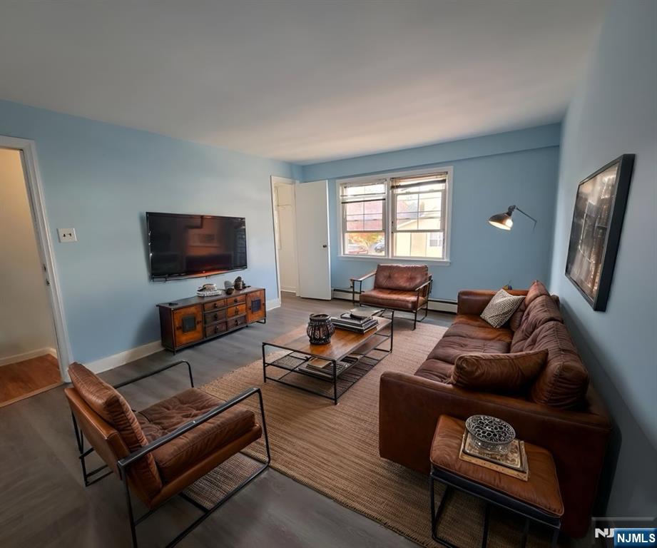 772 Devon Street, Unit 2 Kearny, NJ 07032 - Photo 3 of 10 a living room with furniture a flat screen tv and a window