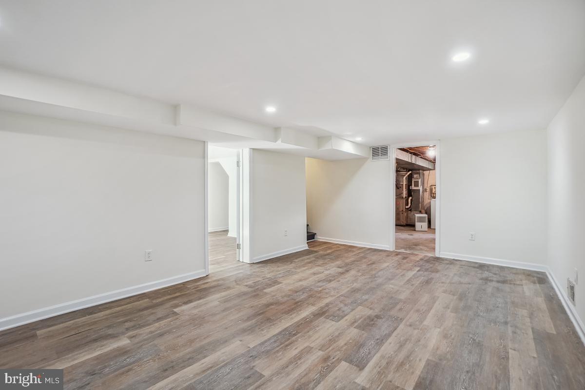 4710 Red Fox Road Rockville, MD 20852 - Photo 20 of 28 Rec room with LVT flooring