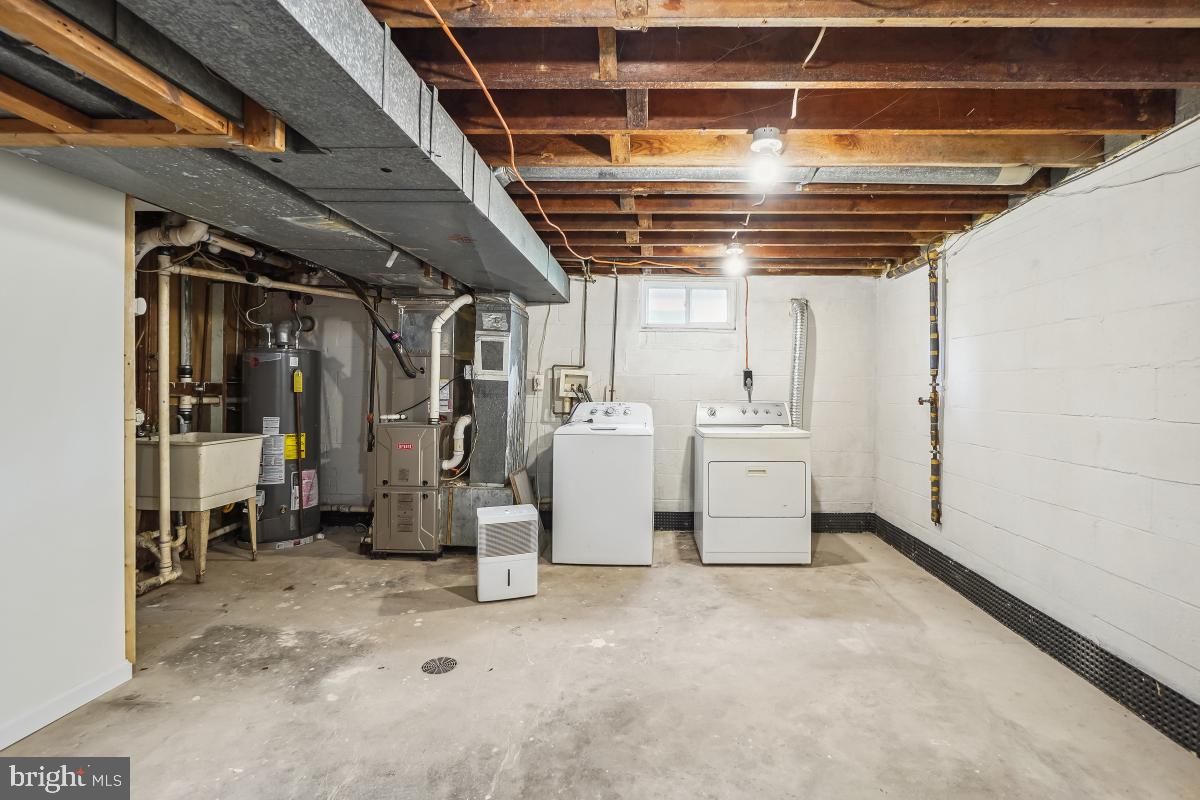 4710 Red Fox Road Rockville, MD 20852 - Photo 26 of 28 Unfinished storage/utility area w/ washer & dryer