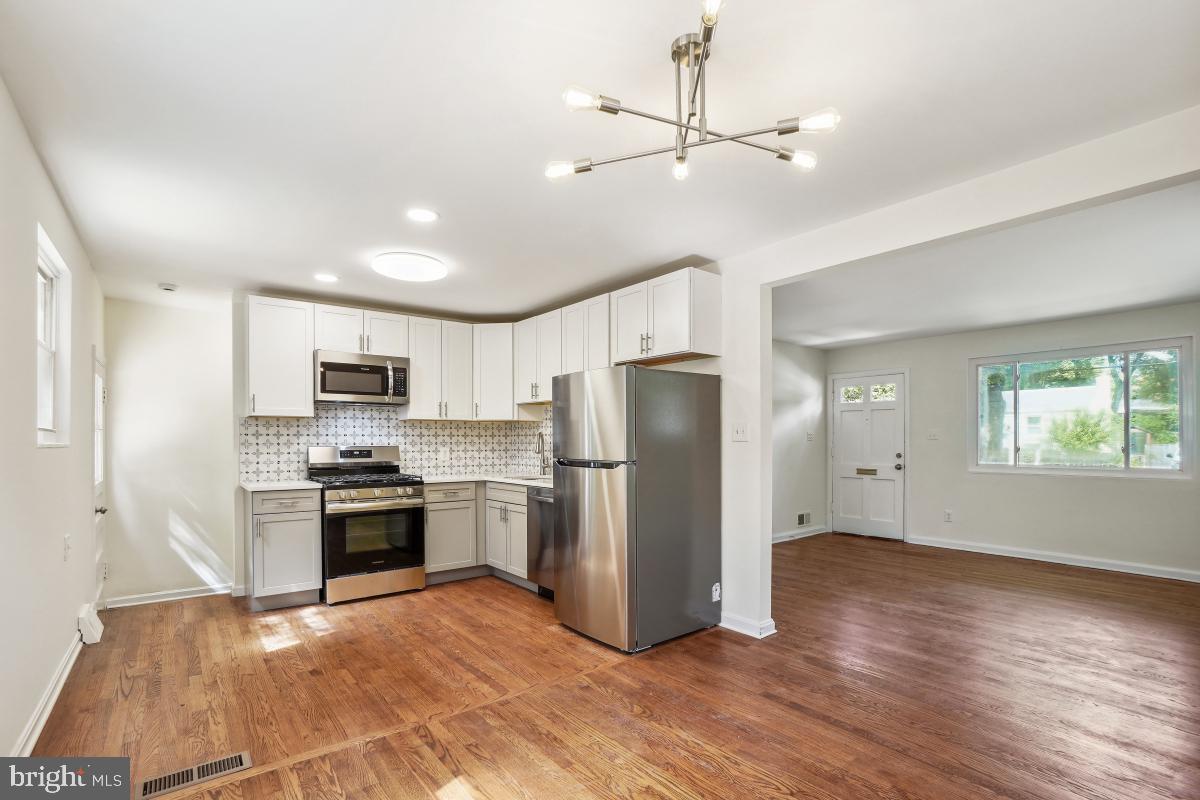 4710 Red Fox Road Rockville, MD 20852 - Photo 6 of 28 Redone kitchen open to dining area