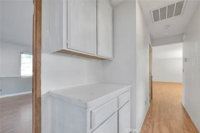 a utility room with washing machine