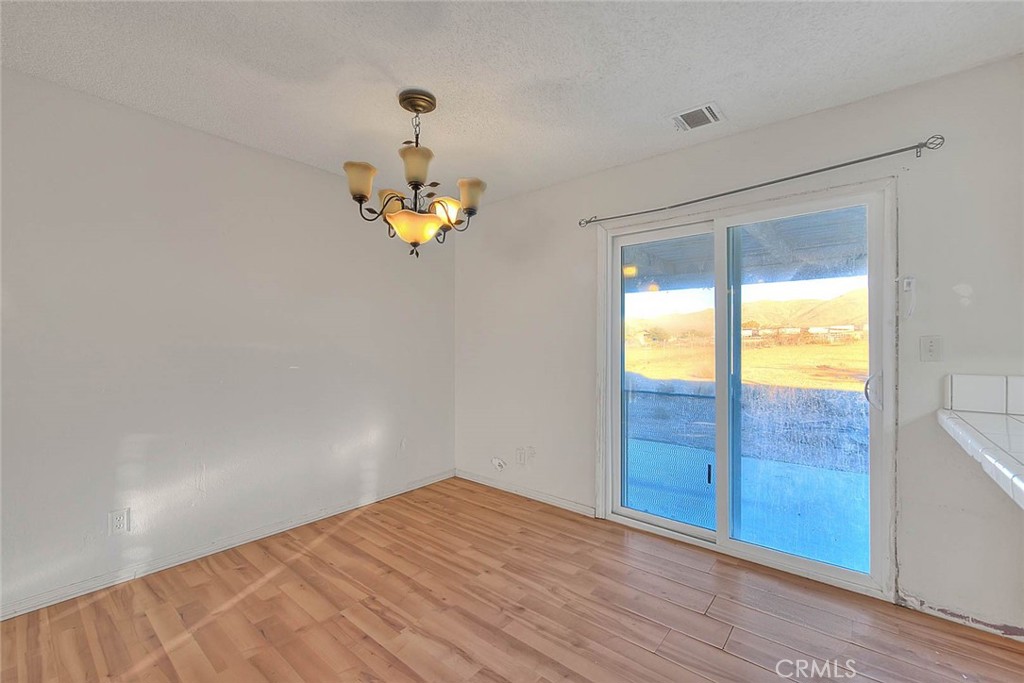 14811 Kingsdale Road Apple Valley, CA 92307 - Photo 21 of 57 an empty room with a window