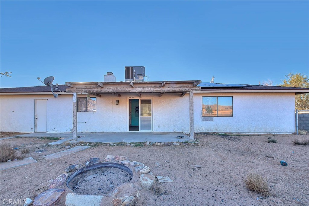 14811 Kingsdale Road Apple Valley, CA 92307 - Photo 32 of 57 a view of a house with a backyard