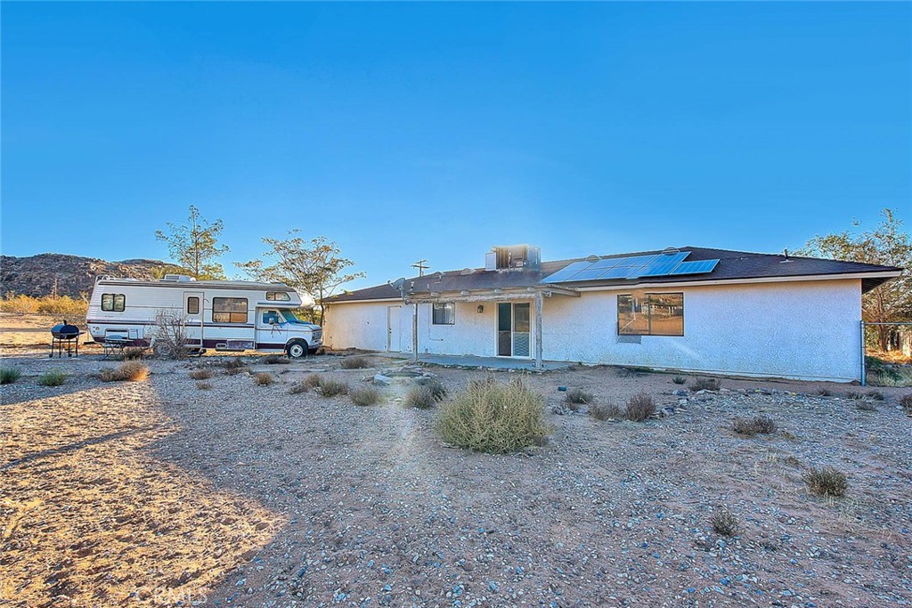 14811 Kingsdale Road Apple Valley, CA 92307 - Photo 33 of 57 a view of a house with a yard