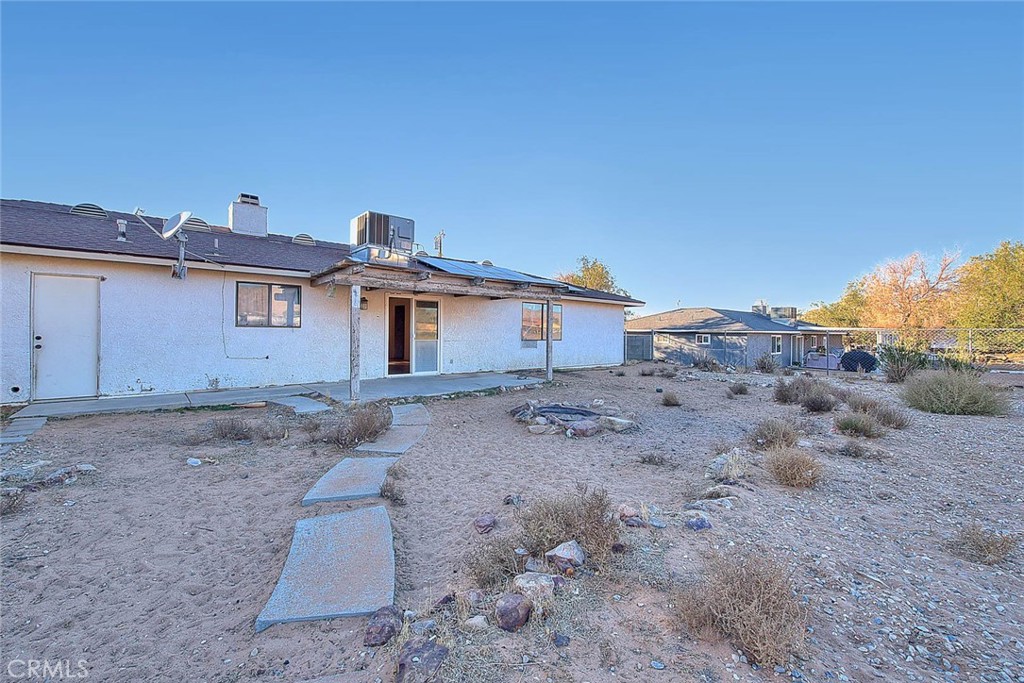 14811 Kingsdale Road Apple Valley, CA 92307 - Photo 34 of 57 a front view of a house with a yard