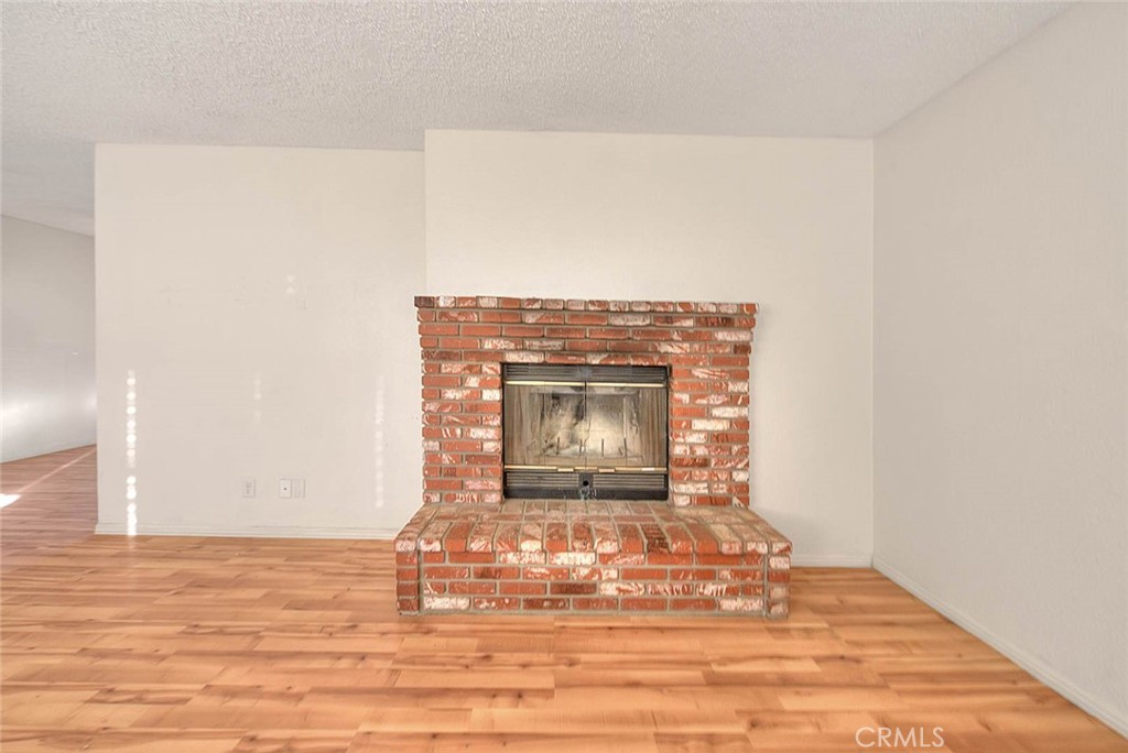 14811 Kingsdale Road Apple Valley, CA 92307 - Photo 8 of 57 a view of empty room with wooden floor