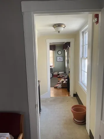 a view of a livingroom and a livingroom with furniture