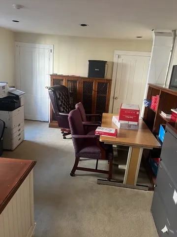 a workspace with furniture and window