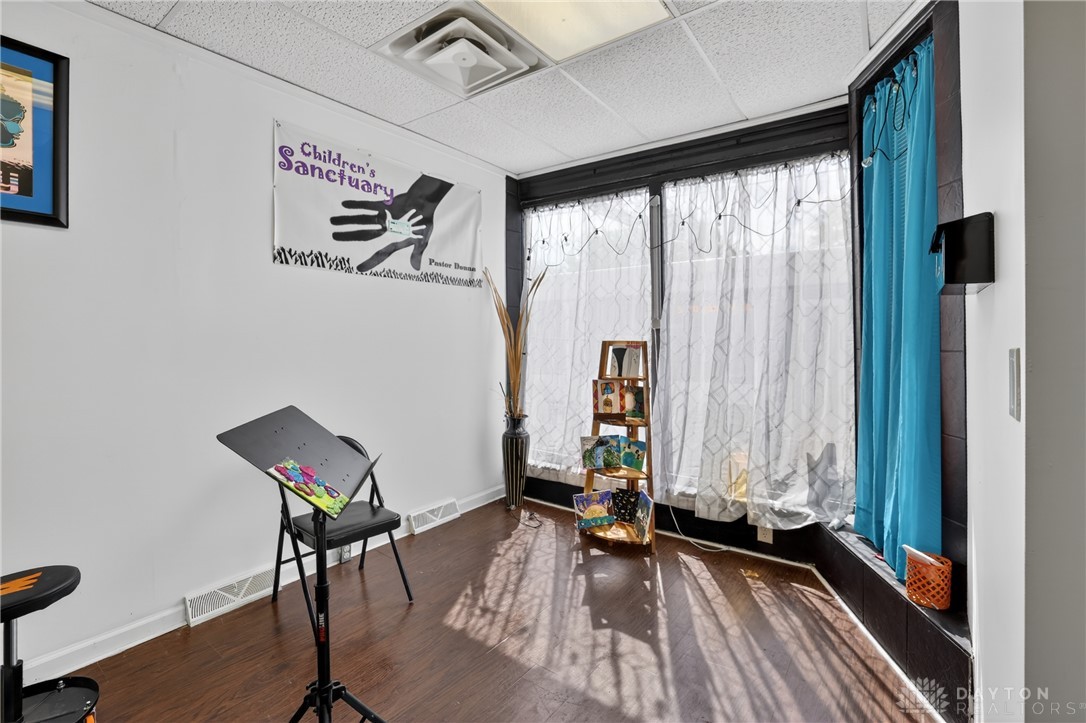 7045-7049 Montgomery Road Cincinnati, OH 45236 - Photo 19 of 68 This spacious room features ample natural light, creating an inviting and airy atmosphere.