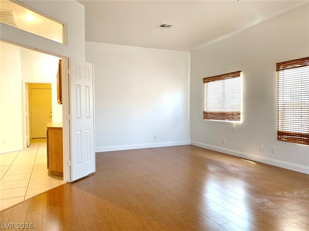 3821 Bombastic Court Las Vegas, NV 89147 - Photo 23 of 36 Bright and airy interior space with warm wood flooring and ample natural light.
