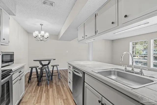 a view of storage and utility room with washer and dryer