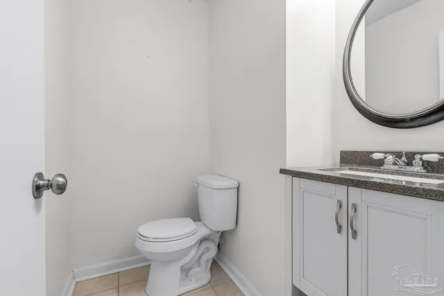 a bathroom with a granite countertop sink a mirror and a mirror