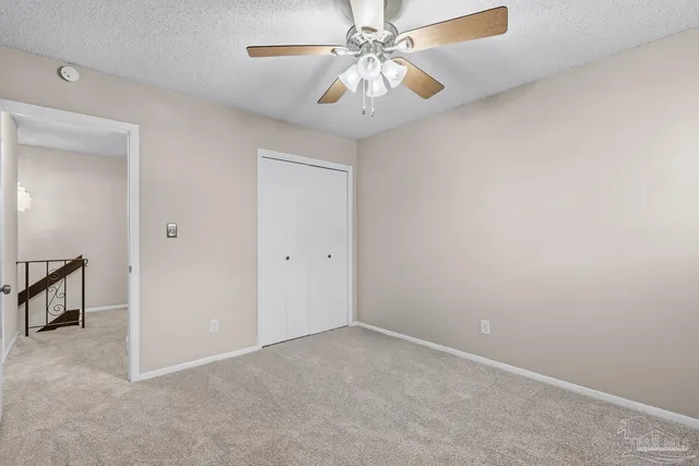 a view of a bathroom with a walk in closet