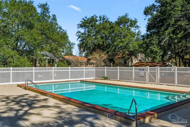 a view of a swimming pool with an outdoor space