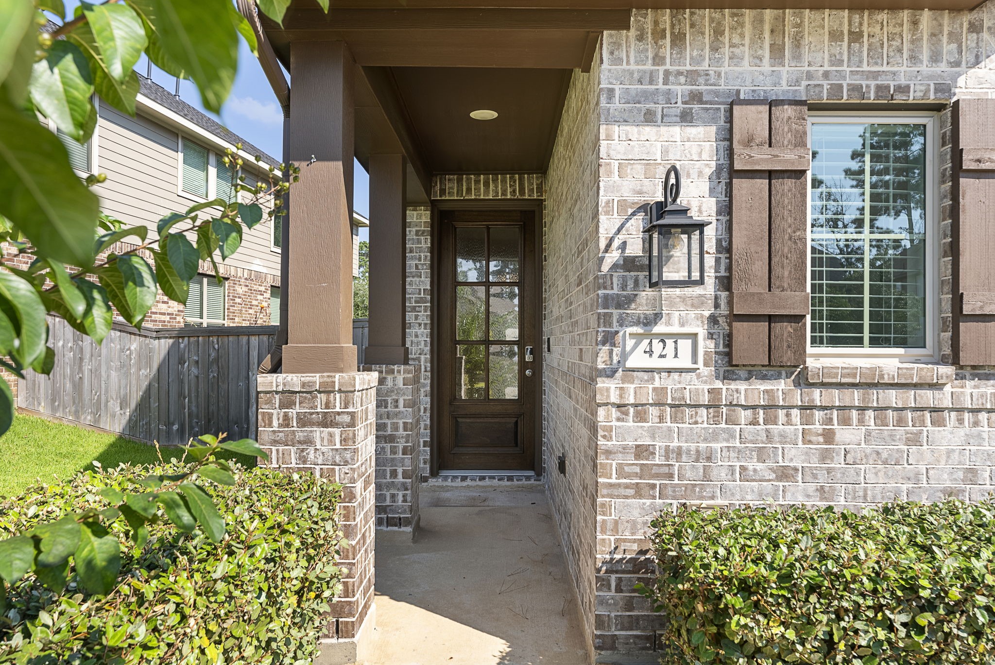 421 Soapberry Tree Court Conroe, TX 77318 - Photo 2 of 50 a front view of a house with a garden